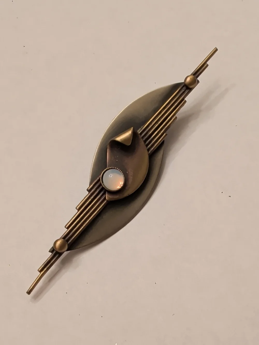 Vintage-Inspired Bronze Bar Brooch with Opalescent Cabochon